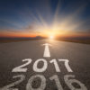 Look Back To Plan Ahead – 12 Year-end Reflection Questions Driving on an empty road towards the setting sun and sunbeams to upcoming new 2017 year and leaving 2016 behind. Concept for success and passing time.
